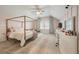 Charming bedroom featuring a four-poster bed, soft lighting, and a stylish vanity area at 3563 Bayden Bridge Ln, Mount Pleasant, SC 29466