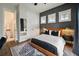 Comfortable bedroom with a dark accent wall and closet doors at 3563 Bayden Bridge Ln, Mount Pleasant, SC 29466