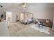 This bedroom boasts a gold canopy bed, sitting area, and serene pink walls, creating a luxurious and inviting space at 3563 Bayden Bridge Ln, Mount Pleasant, SC 29466