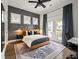 Stylish main bedroom features dark accent wall and access to balcony at 3563 Bayden Bridge Ln, Mount Pleasant, SC 29466