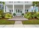 Inviting front porch with brick steps, potted plants, and a charming entryway at 3563 Bayden Bridge Ln, Mount Pleasant, SC 29466