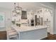 Bright, modern kitchen with a large island, white cabinetry, and bar seating at 3563 Bayden Bridge Ln, Mount Pleasant, SC 29466