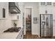 Well-organized pantry with stainless steel fridge and ample shelving at 3563 Bayden Bridge Ln, Mount Pleasant, SC 29466