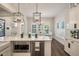 Spacious kitchen island with counter seating and a view into the sunny dining area at 3563 Bayden Bridge Ln, Mount Pleasant, SC 29466