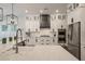 Bright kitchen features white cabinets, stainless appliances, and a stylish black range hood at 3563 Bayden Bridge Ln, Mount Pleasant, SC 29466