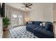 Cozy living room with a large sectional sofa, decorative rug, and lots of natural light at 3563 Bayden Bridge Ln, Mount Pleasant, SC 29466