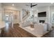 Inviting living room with hardwood floors, cozy seating, and a fireplace at 3563 Bayden Bridge Ln, Mount Pleasant, SC 29466
