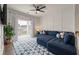 Cozy living room with a large sectional sofa, decorative rug, and lots of natural light at 3563 Bayden Bridge Ln, Mount Pleasant, SC 29466