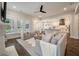 Open living room with hardwood floors, neutral furniture, a ceiling fan, and view of the kitchen at 3563 Bayden Bridge Ln, Mount Pleasant, SC 29466