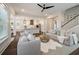 Open-concept living area with hardwood floors, kitchen, fireplace and stairs at 3563 Bayden Bridge Ln, Mount Pleasant, SC 29466
