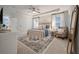 Bedroom with a ceiling fan, sitting chair, natural light, and a large mirror at 3563 Bayden Bridge Ln, Mount Pleasant, SC 29466