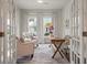 Bright home office with french doors, stylish furniture, and ample natural light at 3563 Bayden Bridge Ln, Mount Pleasant, SC 29466