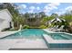 Large, inviting pool and spa surrounded by lounge chairs, perfect for relaxing and soaking up the sun at 3563 Bayden Bridge Ln, Mount Pleasant, SC 29466