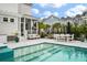 A backyard pool with a seating area offers a refreshing outdoor space for relaxation and entertainment at 3563 Bayden Bridge Ln, Mount Pleasant, SC 29466