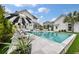 Beautiful backyard featuring a sparkling pool, lounge chairs, and a stylish black and white striped umbrella at 3563 Bayden Bridge Ln, Mount Pleasant, SC 29466