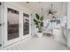 Charming porch with white wood flooring and a cozy swinging bed, perfect for relaxing outdoors at 3563 Bayden Bridge Ln, Mount Pleasant, SC 29466