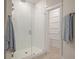 Modern glass enclosed shower with white subway tile and brushed nickel fixtures in a bright, tiled bathroom at 3563 Bayden Bridge Ln, Mount Pleasant, SC 29466