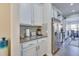 Kitchen featuring white cabinets, stainless steel appliances, and granite countertops with bar seating visible at 404 Snowy Plover Ln, Summerville, SC 29486