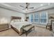 Serene main bedroom suite with tray ceiling, ample natural light, and a sitting area for ultimate comfort at 4263 Hugh Bennett Dr, Johns Island, SC 29455