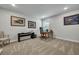 A home office featuring a desk, leather chair, and a gallery wall with framed artwork at 4263 Hugh Bennett Dr, Johns Island, SC 29455