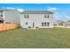 Expansive backyard with well-maintained lawn, outdoor seating area, and privacy fence at 428 Avocet Dr, Summerville, SC 29486