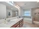 Bright bathroom features a dual sink vanity, soaking tub, and modern fixtures at 428 Avocet Dr, Summerville, SC 29486
