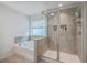 Relaxing bathroom with a shower, separate bathtub, and neutral tiles at 428 Avocet Dr, Summerville, SC 29486