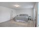 Bright bedroom features a large bed, neutral tones, and a light-filled window at 428 Avocet Dr, Summerville, SC 29486