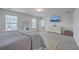 Serene bedroom featuring a comfortable bed, dresser, and a view of the city skyline on the TV at 428 Avocet Dr, Summerville, SC 29486