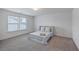 Calm bedroom with a pull-down bed, soft rug, bright window, and neutral wall decor at 428 Avocet Dr, Summerville, SC 29486