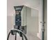 Electric car charging station mounted on a white wall with grey piping at 428 Avocet Dr, Summerville, SC 29486