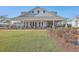 Inviting clubhouse featuring a spacious covered porch, comfortable seating, and well-maintained green lawn at 428 Avocet Dr, Summerville, SC 29486
