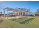 Relaxing community clubhouse with shaded pergola, bench seating, and picturesque views of the surrounding landscape at 428 Avocet Dr, Summerville, SC 29486