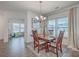 Bright dining room featuring wood flooring, chandelier, and an open layout at 428 Avocet Dr, Summerville, SC 29486