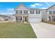 Charming two-story home with a well-manicured lawn and welcoming front porch at 428 Avocet Dr, Summerville, SC 29486