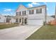 Charming two-story home with well-manicured lawn, covered porch, and attached garage at 428 Avocet Dr, Summerville, SC 29486
