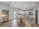 Bright, open kitchen featuring white cabinetry, a central island with seating, and a cozy breakfast nook at 428 Avocet Dr, Summerville, SC 29486