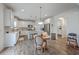 Spacious kitchen with a center island, stainless steel refrigerator, and an adjacent dining area at 428 Avocet Dr, Summerville, SC 29486
