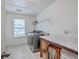 Bright laundry room with modern washer and dryer, ample counter space, and convenient overhead shelving at 428 Avocet Dr, Summerville, SC 29486