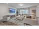 Spacious living room with a large sectional sofa, TV, and lots of natural light at 428 Avocet Dr, Summerville, SC 29486