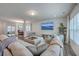 Spacious living room with comfortable seating, TV, and open layout to dining at 428 Avocet Dr, Summerville, SC 29486
