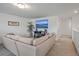 Upstairs loft featuring a comfortable sectional sofa and a large television at 428 Avocet Dr, Summerville, SC 29486
