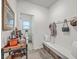 Hallway offers storage bench and opens to a half bath at 428 Avocet Dr, Summerville, SC 29486