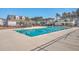Large community pool with clear blue water, surrounded by comfortable lounging areas and lush landscaping at 428 Avocet Dr, Summerville, SC 29486