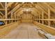 Unfinished attic space with exposed wooden beams and rafters, providing potential for customization at 455 Hidden Meadow Ln, Summerville, SC 29486