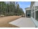 The backyard includes a concrete patio, a wooded lot, and a black metal fence at 455 Hidden Meadow Ln, Summerville, SC 29486