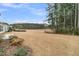 A spacious backyard with a lawn, landscaping, and trees offers a tranquil setting at 455 Hidden Meadow Ln, Summerville, SC 29486