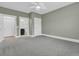 Spacious bedroom with neutral walls, carpet, ceiling fan, and ensuite bathroom at 455 Hidden Meadow Ln, Summerville, SC 29486