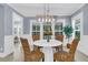 Cozy dining room with a round table, wicker chairs, and natural light from large windows at 455 Hidden Meadow Ln, Summerville, SC 29486