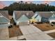 Charming one-story home with light blue siding, a grey roof, an attached garage, and a concrete driveway at 455 Hidden Meadow Ln, Summerville, SC 29486